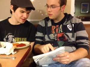 Tyler Ludwig and Alex Groenweghe, adding on to their script at Denny's.