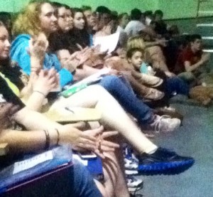 The drama club listening to the speeches of the candidates. 