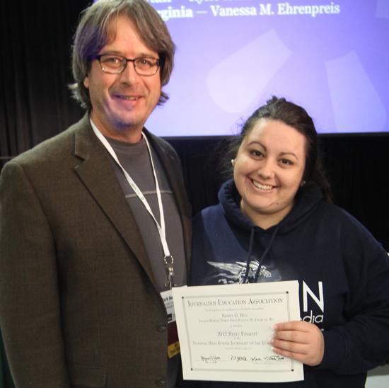 Journalism Education Association President Mark Newton takes a moment to pose with FHN senior Kelsey Bell after she was named the 2012 National High School Journalist of the Year.