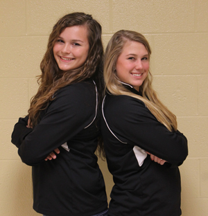 Two senior soccer players continue to play together