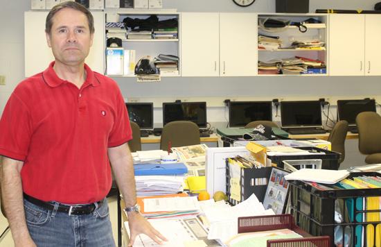 De Ciechi stand by his desk. He currently teaches personal finance and marketing. De Ciechi has been teaching at North for 16 years and will be retiring after this year.