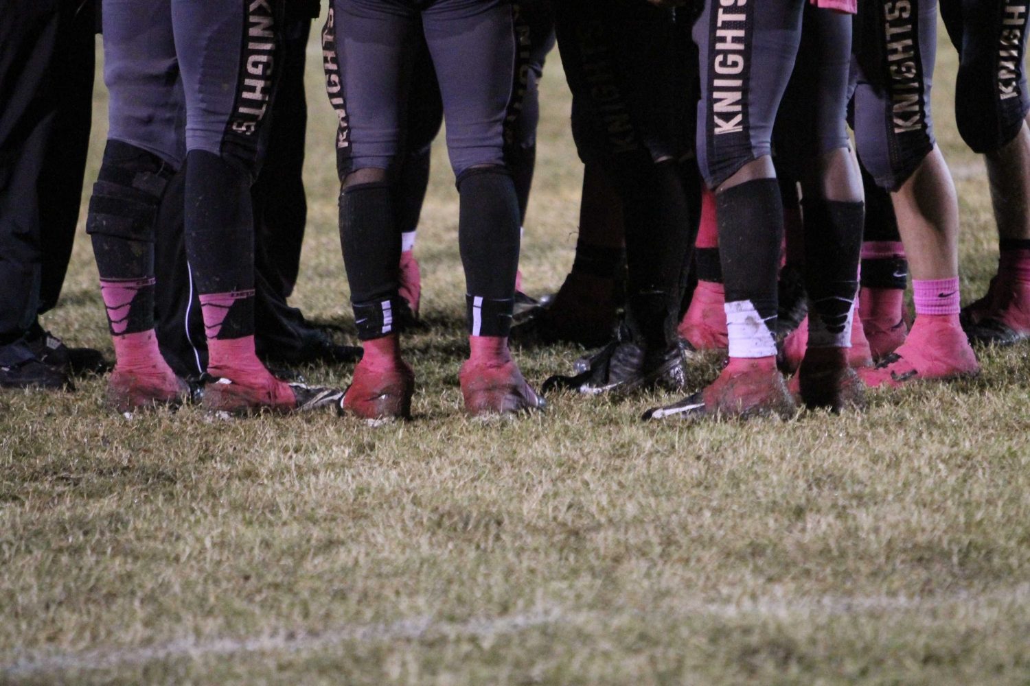 Varsity football teams sports their pink socks in support of breast cancer awareness at annual Pink Out game October 5, 2012.