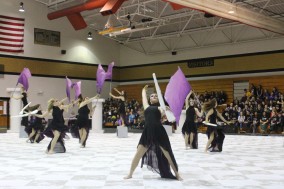 Winter guard competes at Art in Motion competition in the FHN large gym.