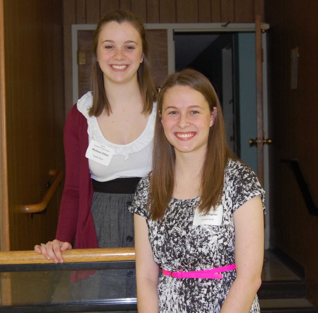 Seniors Maddie Eifert and Carly Wagner pose for a picture at the First United Methodist Church after receiving their STEM awards for science and math.