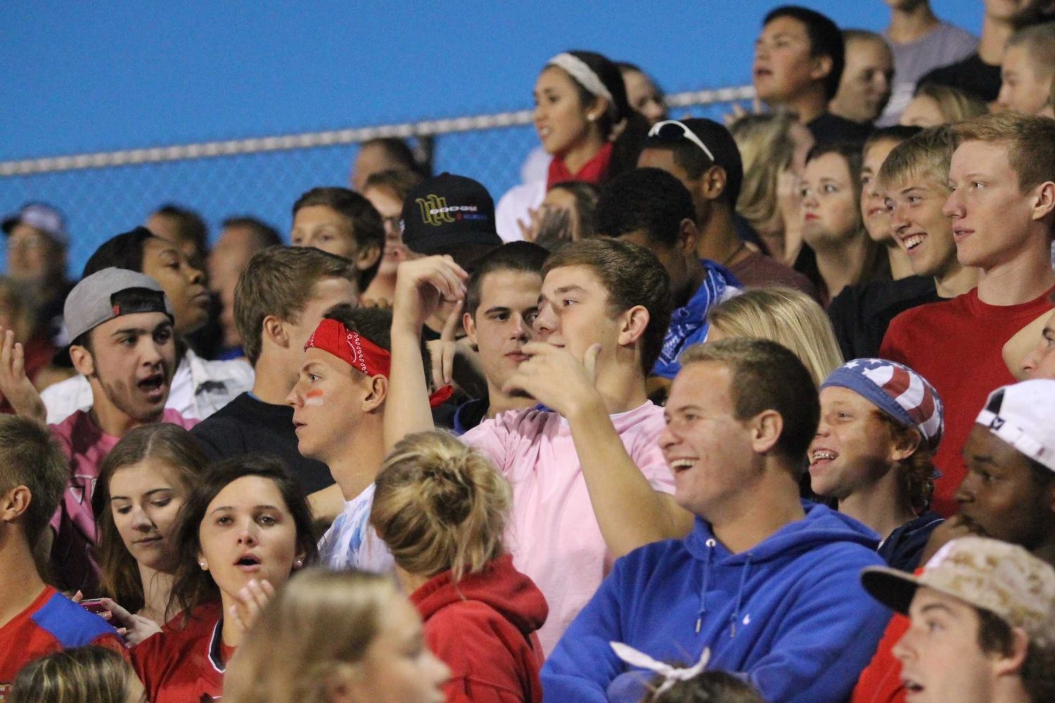 Fans cheer in the stands at the American themed varsity Football game (megan tanksley)