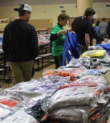 Shoppers look at all the hoodies they have to choose from at the Nike sale.