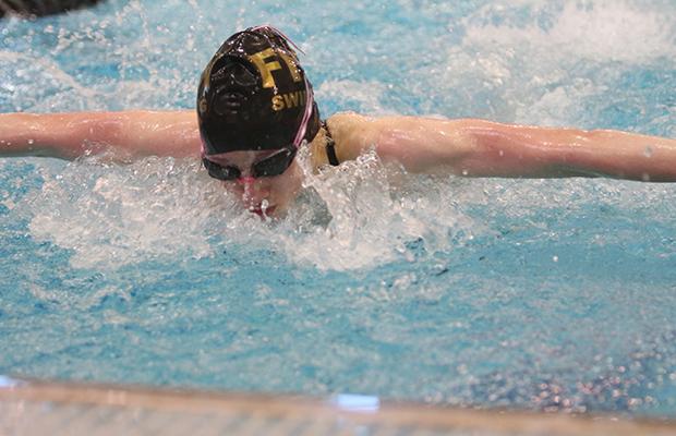 Freshman Erin Stock competes in the 100 yard butterfly. Stock got 3rd place at the GAC finals on Thursday Feb. 12. Stock will continue on to state at the Rec Plex on tba