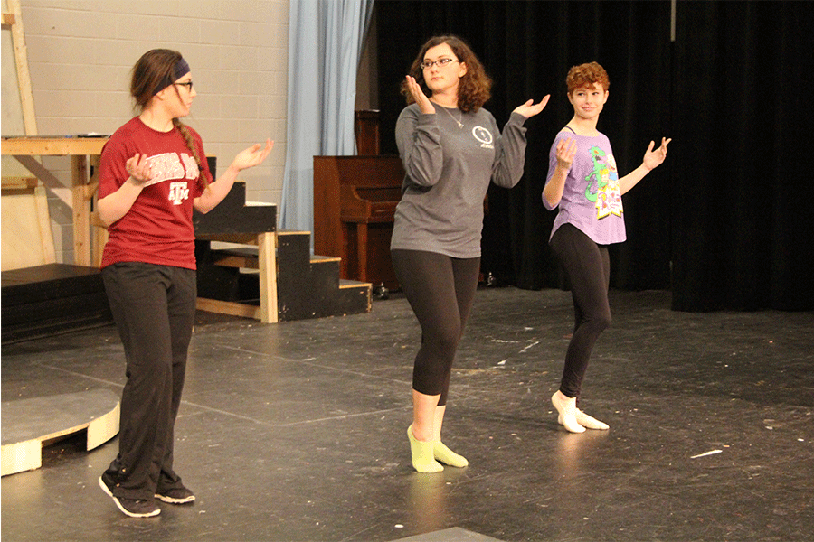 Junior Brianna Smith, senior Erika Paar, and sophomore Kayliani Sood practice the choreography for the song “Be Our Guest” after school. This is the first year that Hollenbeck has joined any production at North.