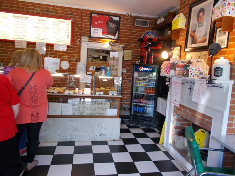 Customers wait in line at the popular, family-owned cookie store on St. Charles Main Street.