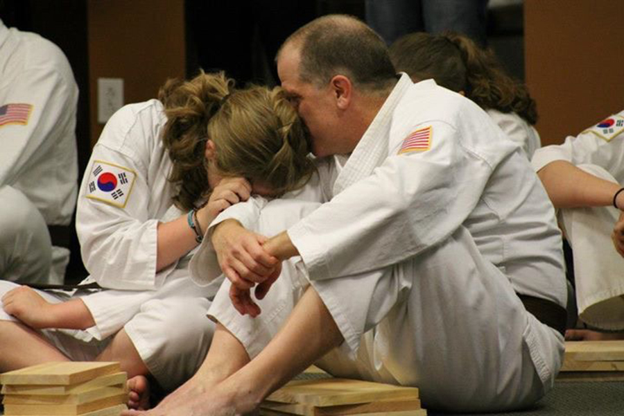 Amanda Puhse leans on her Robert Puhse. Amanda and her father have been working together with taekwondo for about 10 years. Taekwondo has become a growing part of both of their lives ever since they were young. 