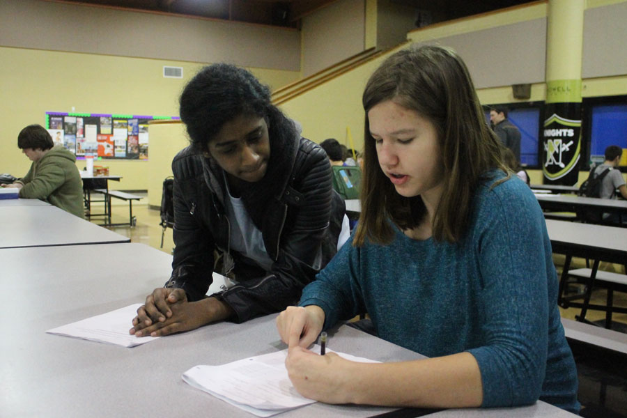 An FHN Mentor helps a student while studying at the Cocoa and Cram in 2016.