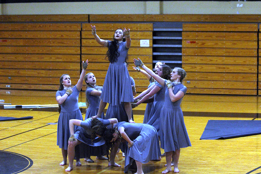 Freshman+Jenna+Brown+begins+to+fall+backwards+to+conclude+their+performance.+%5BQuote+from+Jenna+about+falling%5D