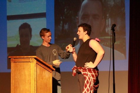 Senior Anthony Kristensen  and Junior Christian Witte talk on stage during Kristensens slideshow performance. His slideshow started off with many “teacher lookalikes” around FHN, comparing them to actors and even movie characters. He then moved onto comparing the other Mr. FHN contestants and even himself to other people. 