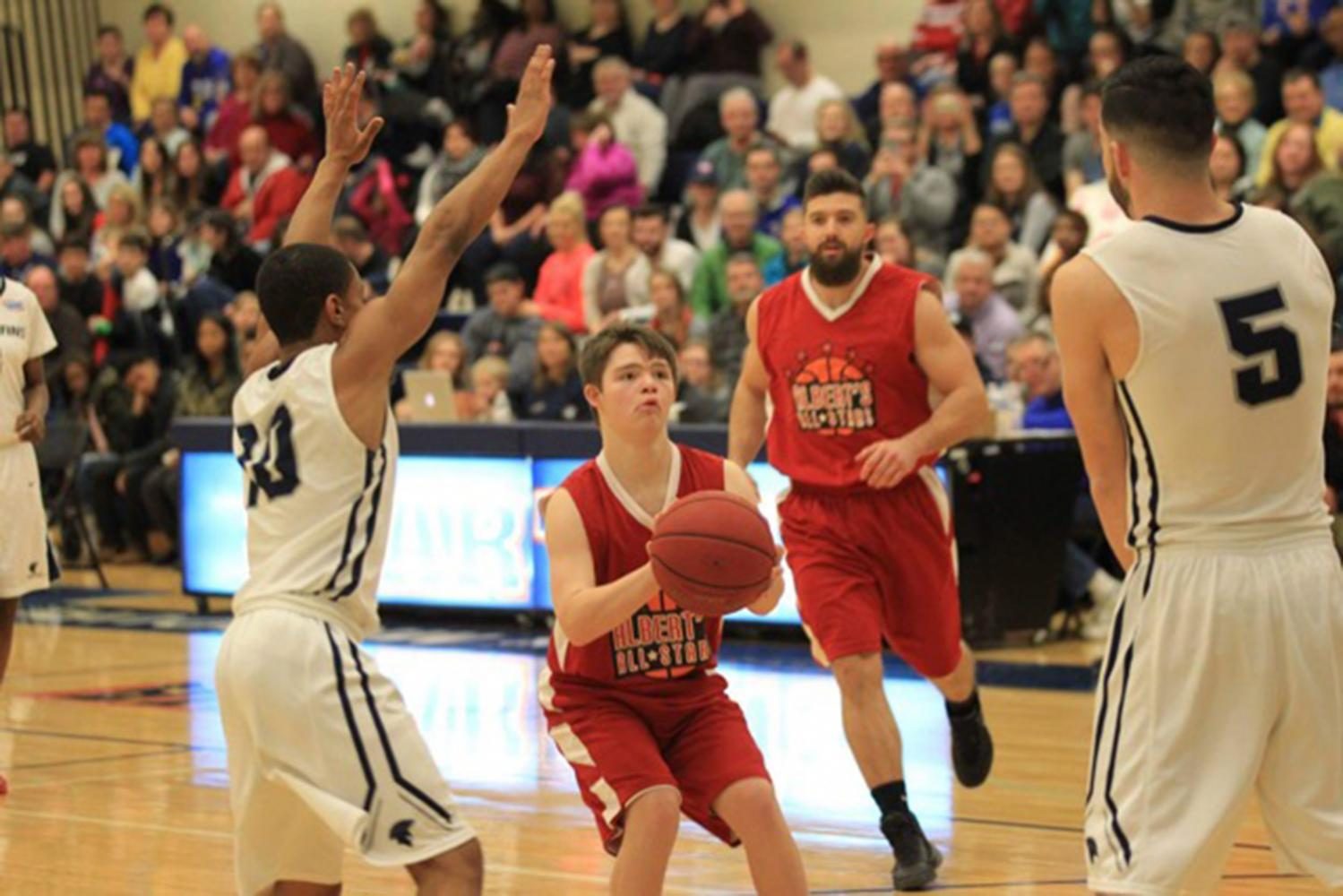 Freshman Bret Hammond prepares a shot during the All-Star basketball game. (photo submitted by James Hammond)