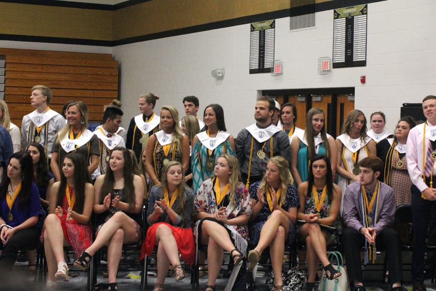 The NHS members in the senior class of 2016 stand at Senior Awards Night. 
