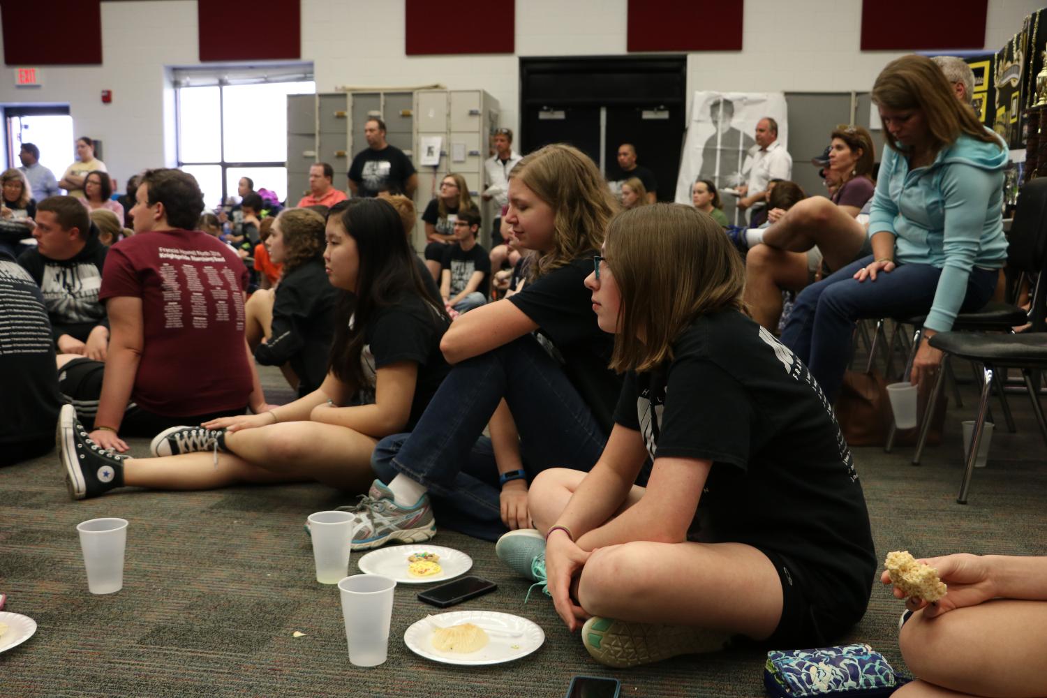 Freshmen Corynn Argent, Emma Temper, and Emilee Statzer listen to Rob Stegeman talk about the new marching band show. A new drum major has been chosen to help lead the band. Freshman Grace Sickendick has stepped up and will be the junior drum major this next season.
