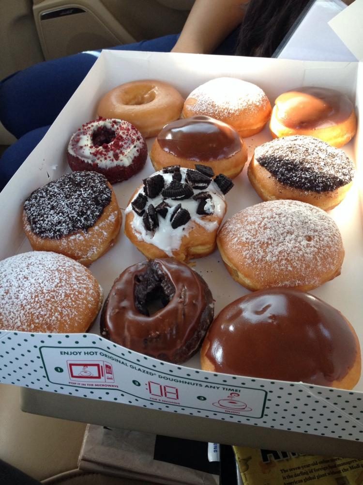 This is a box of a variety of Krispy Kreme donuts.