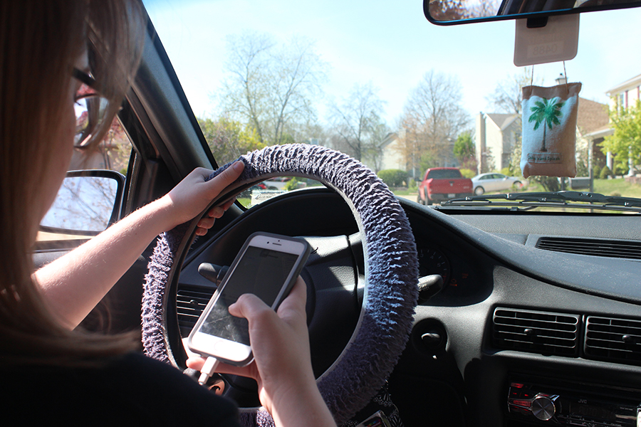 Most teenagers have the tendency of texting and driving, the thought of setting down their phones being unheard of. Phones have had some negative impacts on teenagers in their daily life. From decreasing grade point averages to deaths from distracted driving, the usage of phones can have major impacts. (Photo by Rachel Kehoe)