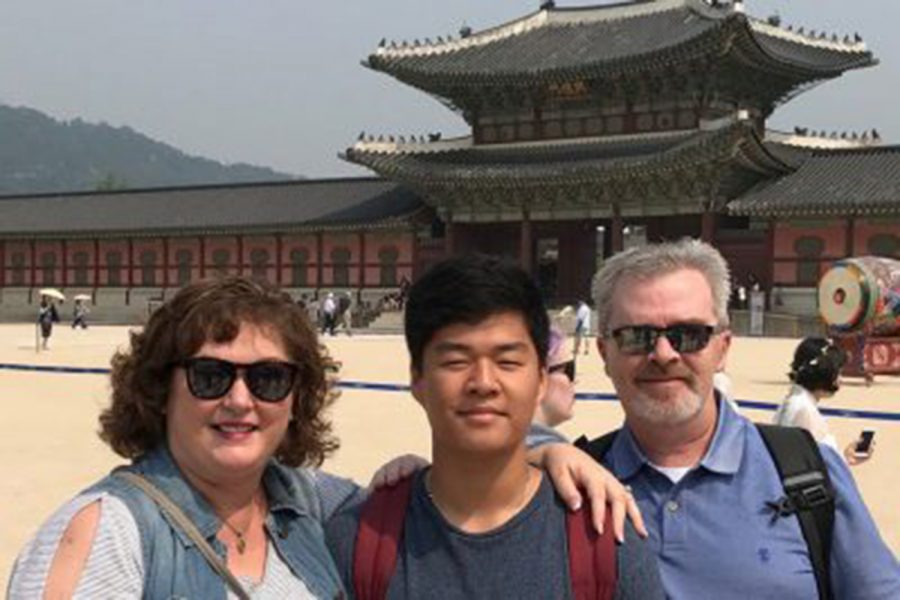 (left to right) Kathy, Grant, and Guy Argent pose for a picture in front of Gyeongbokgung Palace in Seoul,
South Korea. Kathy and Guy plan on more trips to the country for their younger children, Corynn and Clark,
both also from South Korea, making it so each child has an individualized experience. (Photo submitted)