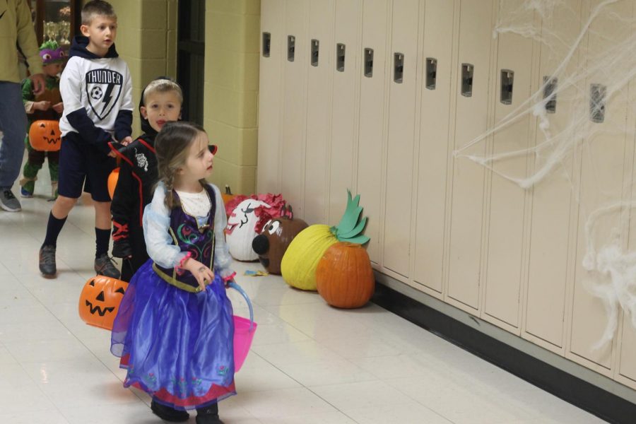 Children+walk+down+the+halls+of+FHN%2C+in+costume%2C+on+Oct.+27.+Student+Council+held+its+annual+Trick-or-Treat+Street%2C+with+11+clubs+participating+this+year.