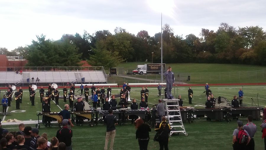 Junior Drum Major Sam Weaver salutes the judges as the FHN Knightpride Band prepares to perform at Music in Motion.