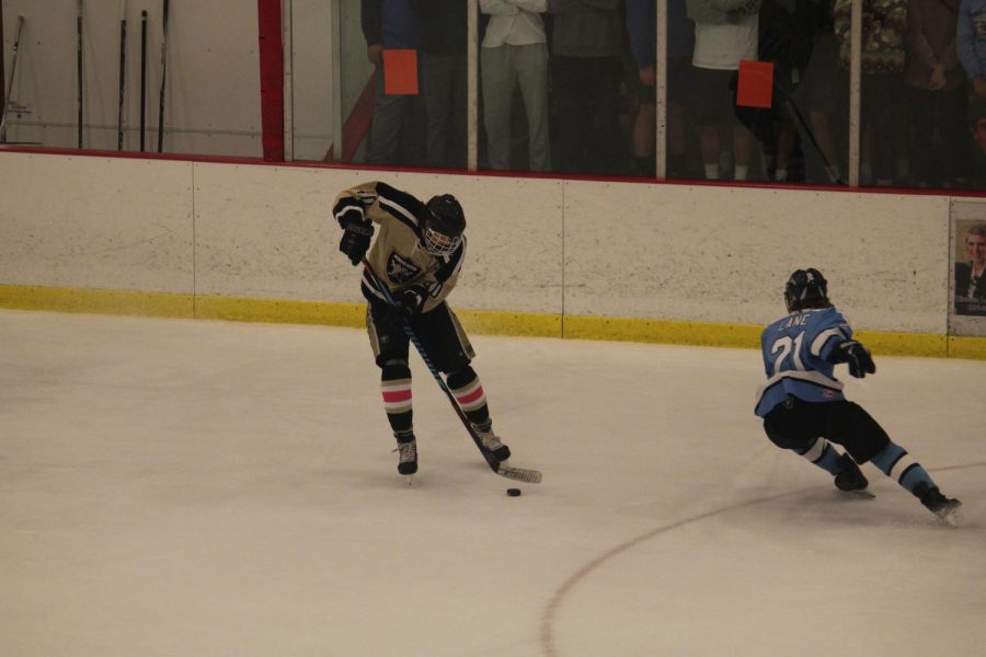 The Knights take possession of the puck vs. Francis Howell in their annual Gold Cup game on 11/4. 