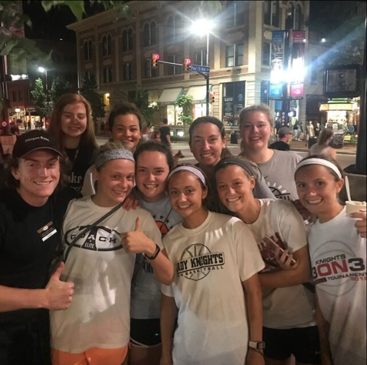 Members of the team pose with a Ben & Jerrys worker on Pearl Street