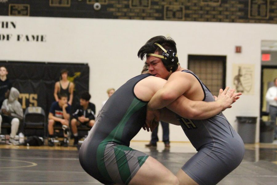 Senior Bon Jang wrestles in a match against Timberland on Jan. 11. The team lost this match with a final score of 15-54. More than half of Timberland’s team points were earned because FHN had to forfeit matches due to not having a wrestler in a weight class where Timberland did.