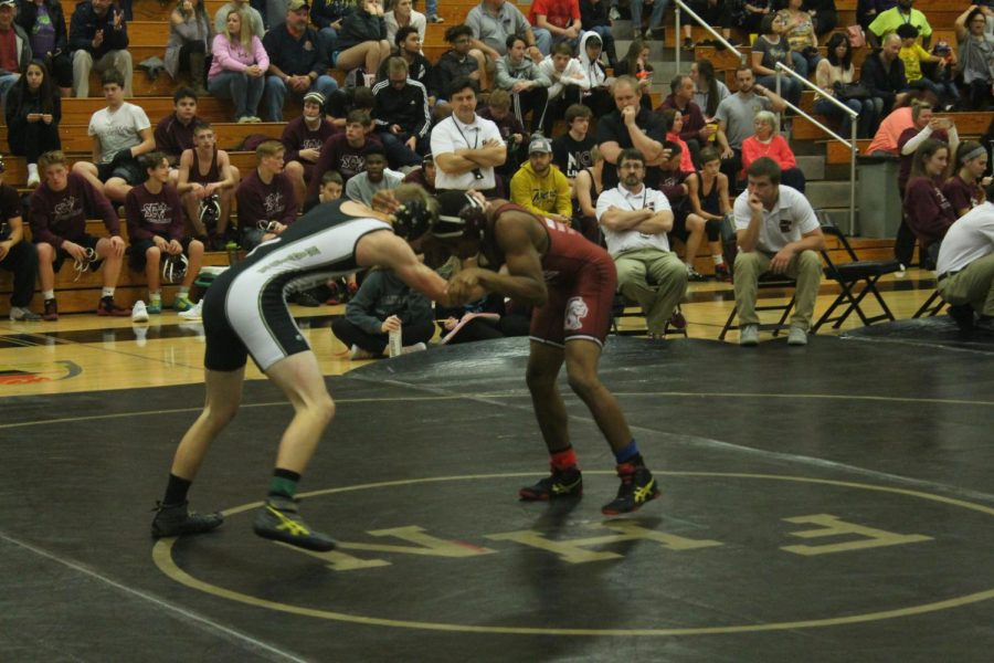 Junior Cole Hayse wrestles for FHN against St. Charles West.