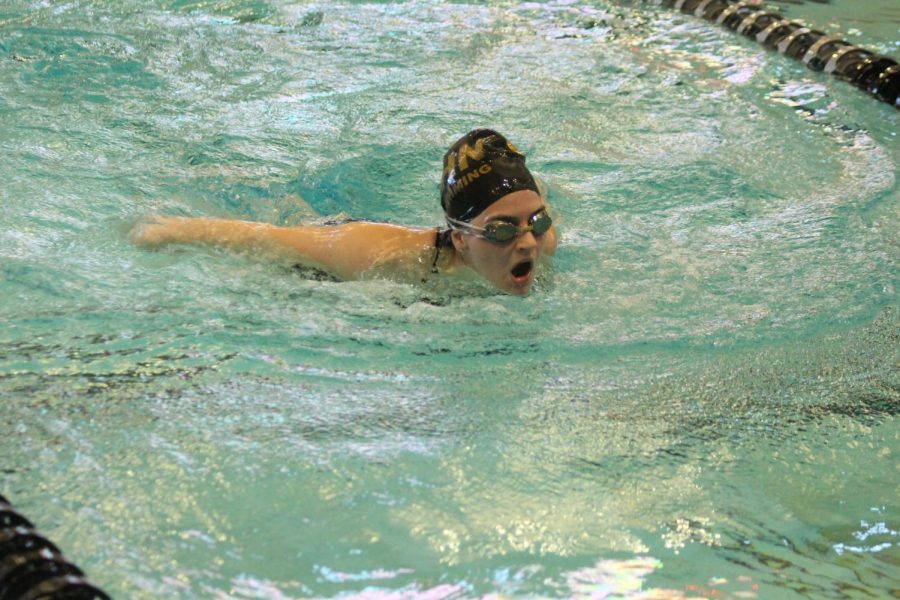 The varsity girls swim team competes in a meet for FHN.