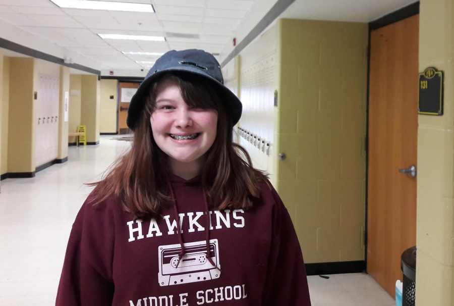 KOE Member Hannah Davis poses in the hat she wore on Feb. 7 for KOEs third hat day. All money from this fundraiser will be donated to FHNs adopt a family.