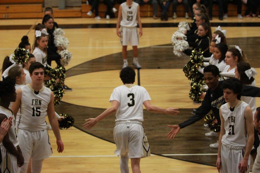 Junior Max Smallwood  heads onto the FHN  court in the large gym in a game against Timberland.