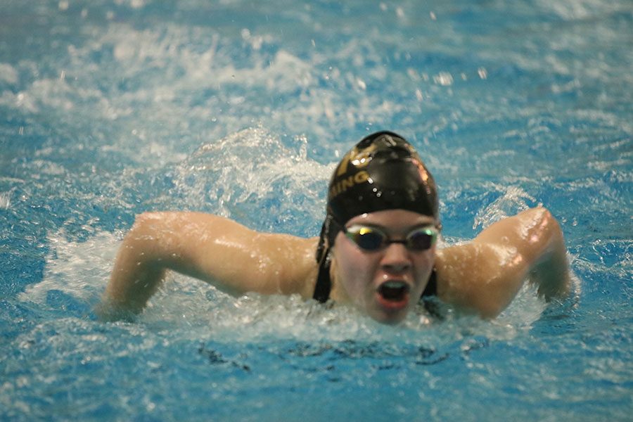 A swimmer from FHN competes in the 100m butterfly event.
