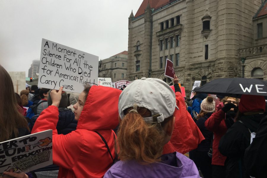Protestors marching at the STL March for Our Lives on March 24. Many brought umbrellas in case of rain, as well as signs carrying slogans and messages.
