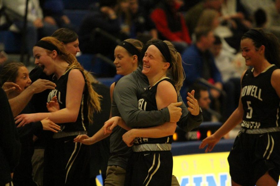 The Lady Knights celebrate  after a good basket against Francis Howell High on 1/19.