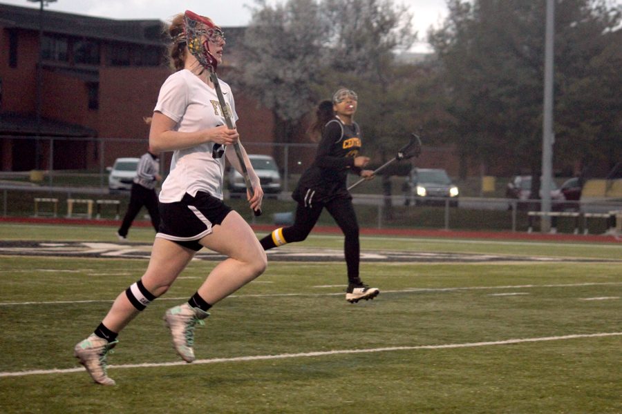 Senior Autumn Schrader runs down the field during a game against Hazelwood Central
