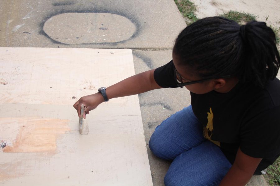 Sophomore Carolyn Green paints a portion of the set for the upcoming play “You
Can’t Take it With You”. The play highlights two families, one proper and the other
disfunctional, and the struggle of love and acceptance. “You Can’t Take it With You”
is scheduled for Oct. 25-27 from 7pm to 9:30pm. 