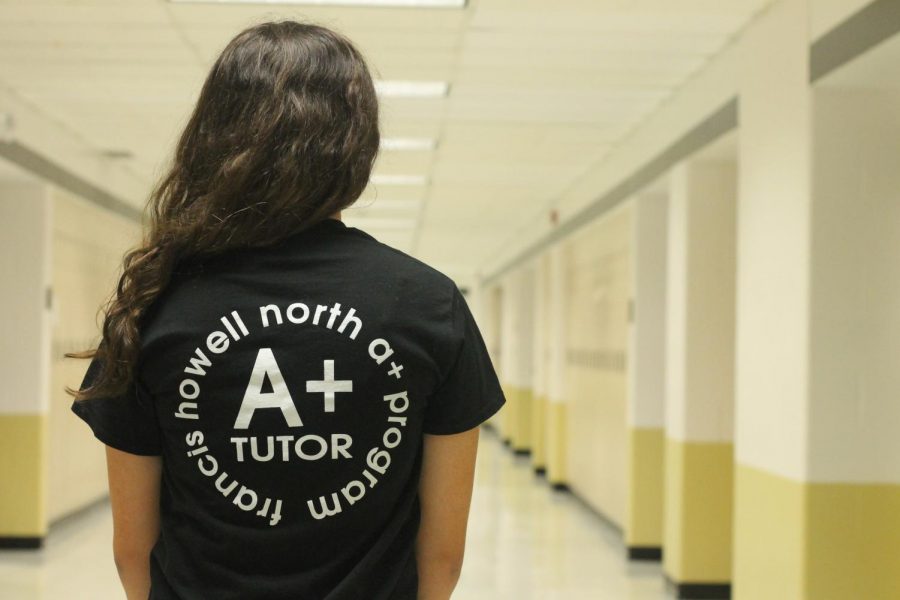 Senior Mariam Hamdan poses with an A+ shirt on. The A+ program is offered to juniors and seniors for an oppurtunity to get two years of community college free. Hamdan worked over the summer at Becky David middle school to get for the program.  