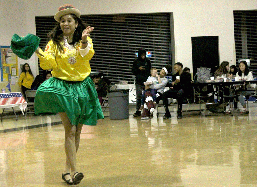 A woman from the Hispanic Festival performs a Bolivian dance. Her dance started at 6 p.m. followed by a Mexican dance. There were eight performances in total.