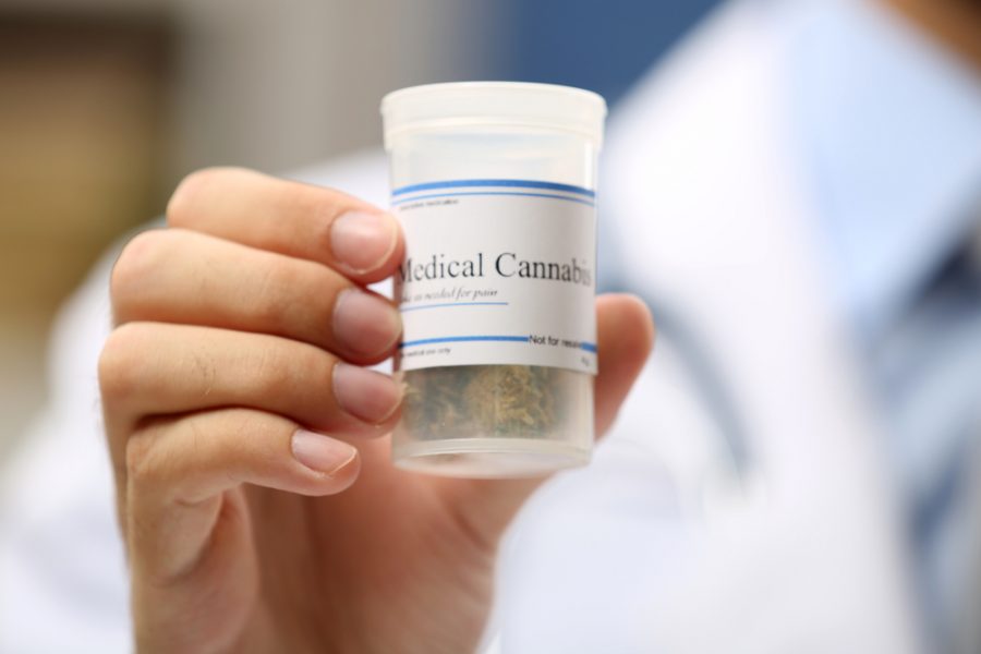Doctor hand holding bottle with medical cannabis close up (Image from Shutterfly)