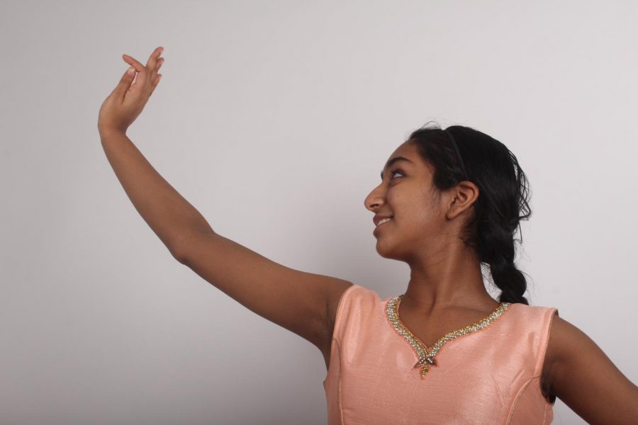 Freshman Amoolya Pandurangi poses for a picture while showing off some of her dance positions. Pandurangi has
been dancing for five years and plans on continuing dance in her future. “My favorite thing about dancing is the footwork.
In kathak footwork is one of the highlights of it and it just brings me joy,” says Pandurangi