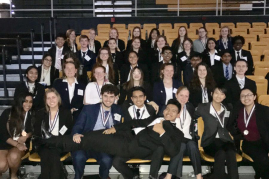 HOSA poses in front of the camera for a photo after their competition. HOSA is a club consisting of those interested in pursuing a future career in the medical field. 18 members were able to achieved top three for their event.