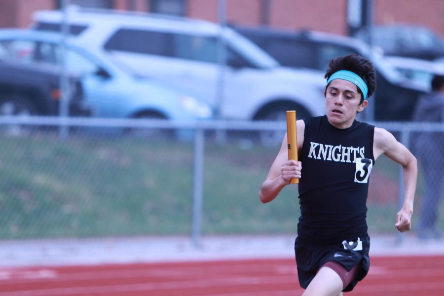 Sophomore David Lopez runs in the 4x800 relay at the Friday Knight Relays 