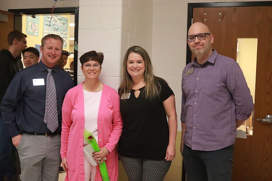 [From left to right] Head Principal Nathan Hostetler poses with Howell of Fame Inductee Donna Malkmus. Two District representatives, Deanna Kruse and Adam Corbitt, presented Malkmus with the honor.
