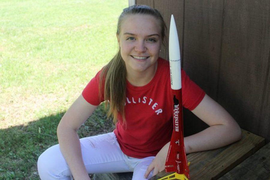 Sophomore Amber Sheulen poses with a small model of a rocket. Sheulen is in a program called CAP which is basic training for the Air Force. In CAP, they do many things such as working out, learning to fly and flying planes, even looking at some rocket science.