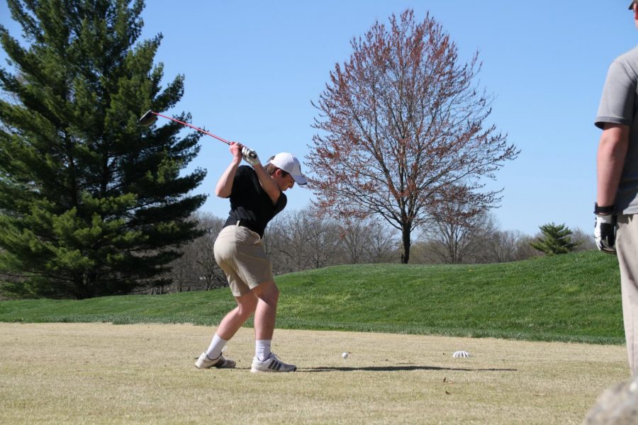 Freshman Joey Key swings his club in a round of golf.