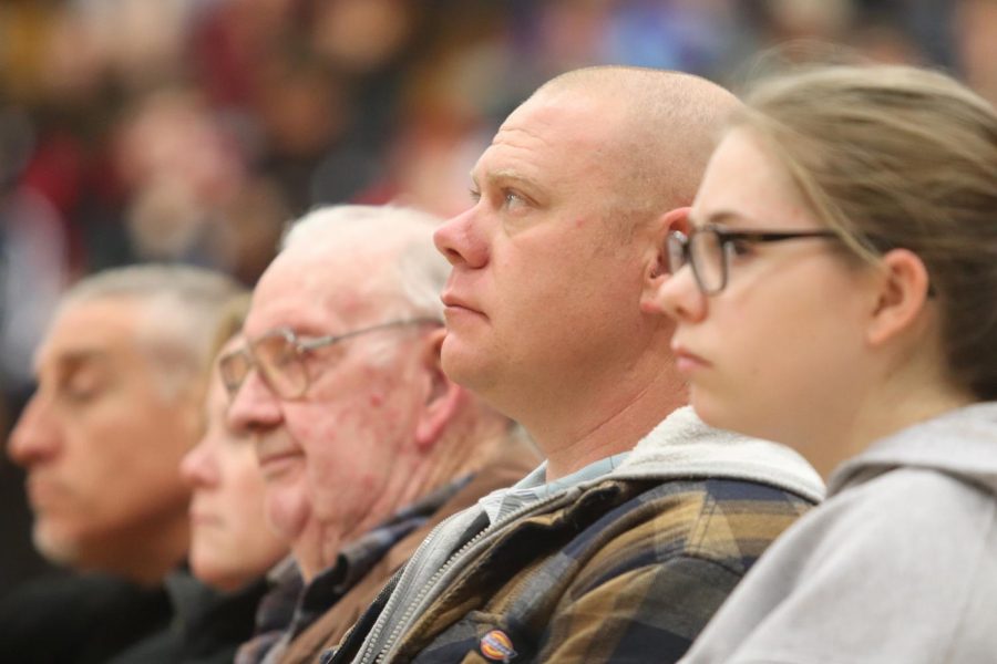 Sergeant Corey Stutsman sits and watches during the Veterans day Assembly.