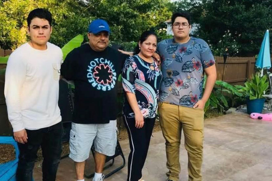 Jesus DeLaPaz [far left] stands with his Father and Mother [center] as well as his brother Julian [far right] during a visit with their family in Tennessee last summer.