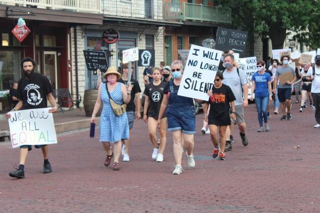 St. Charles residents protest on Main Street St. Charles over the summer, calling for justice for the death of George Floyd and in support of the Black Lives Matter movement.