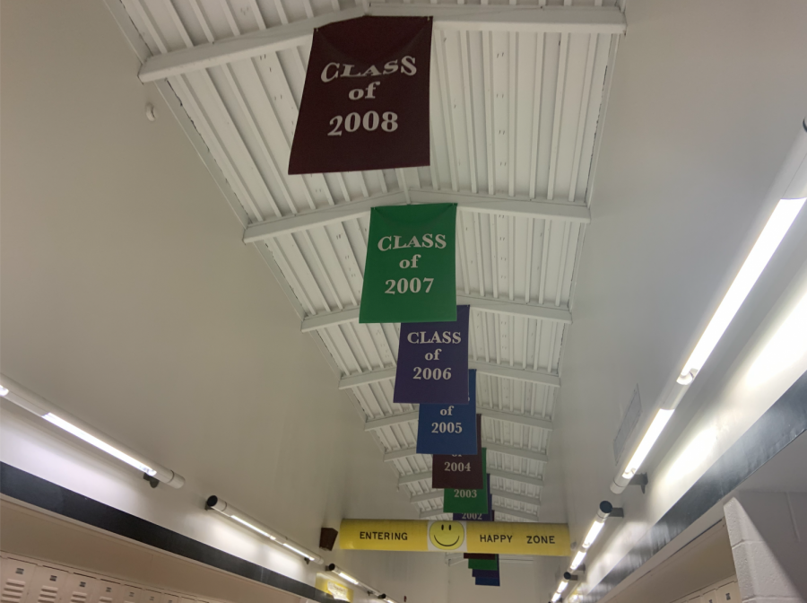 Senior banners hang on the ceiling of the top floor at FHN. Each banner is printed with both the senior classs year and their selected quote.